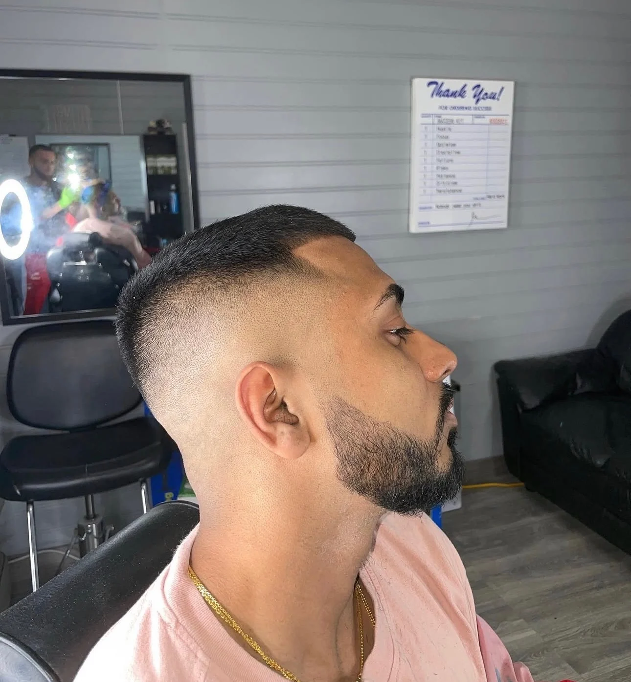 The same client after a skin fade, hairline and neckline cut in clean