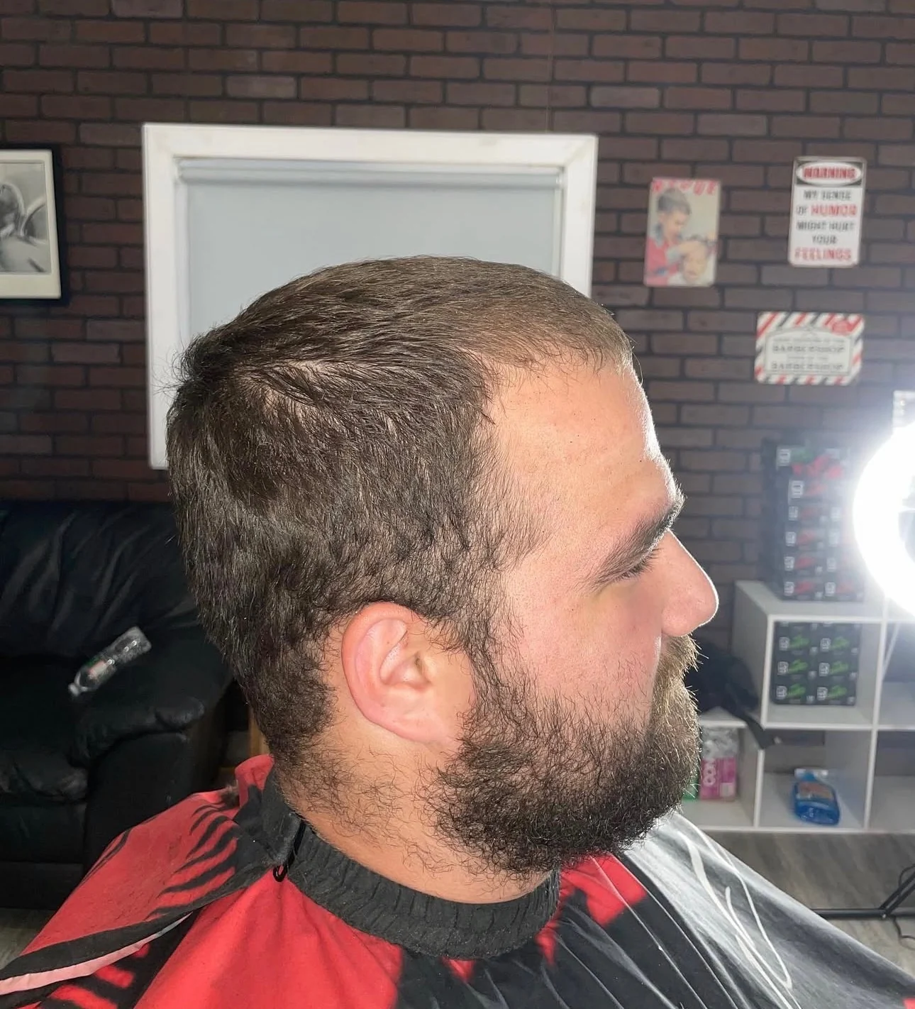 Client before the cut, hair and beard both grown out and unshaped